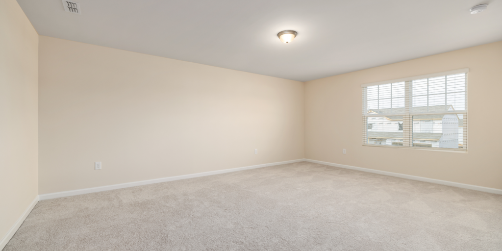 Newly finished residential room with smooth drywall walls and ceiling after installation.
