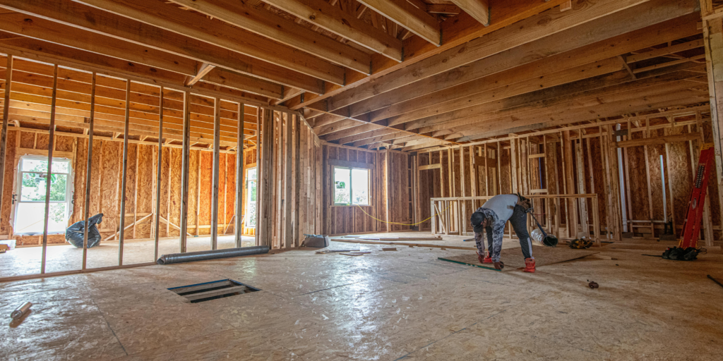 Wood framing structure inside a residential building under construction before drywall installation.
