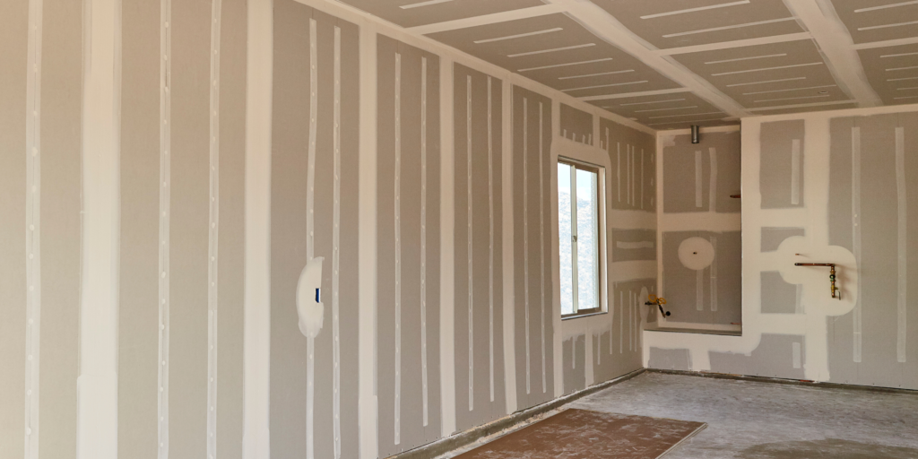 Freshly installed drywall boards in a new home interior during drywall boarding and finishing in Chilliwack. 
